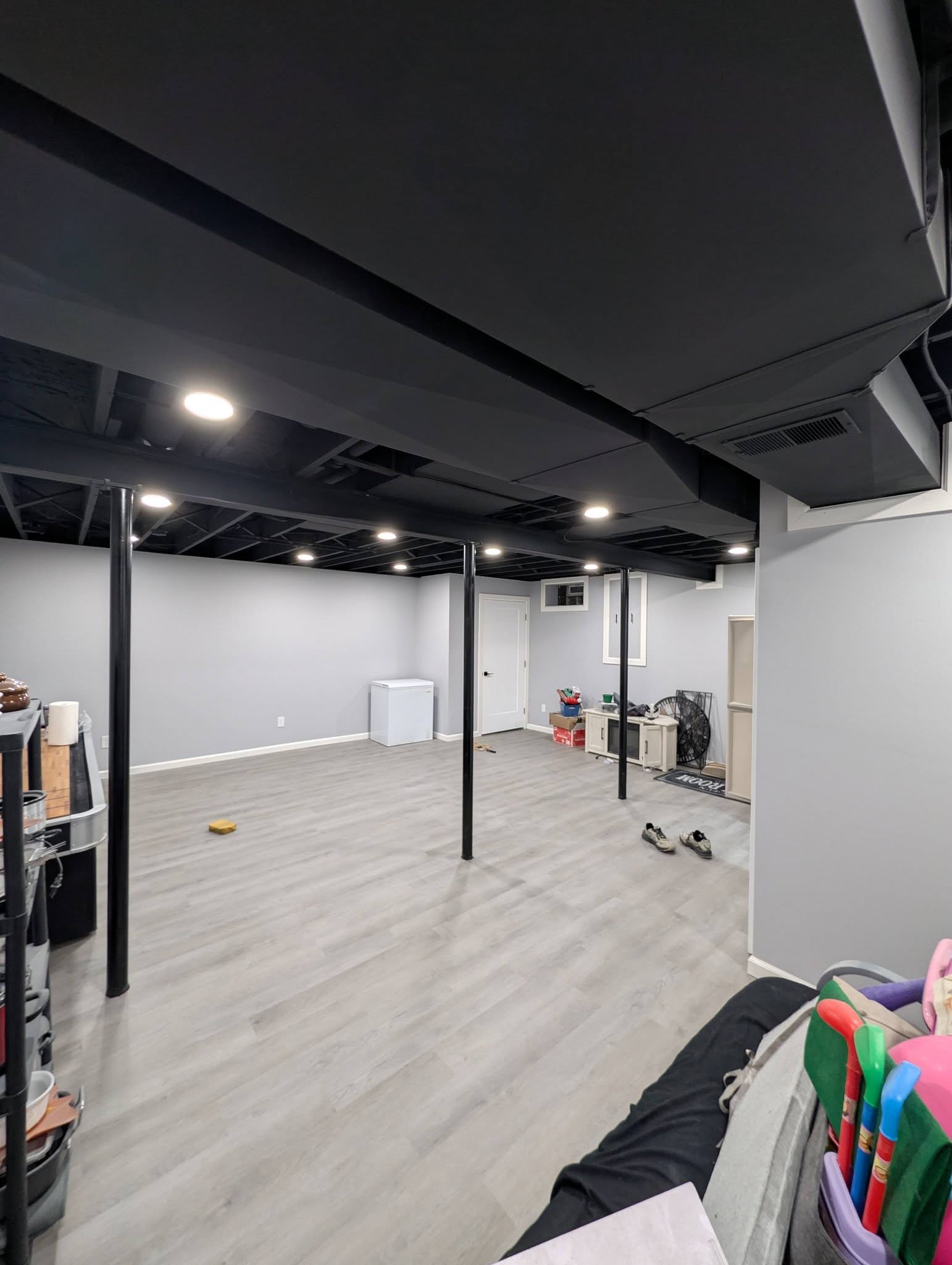 Finished basement living space with sliding barn doors