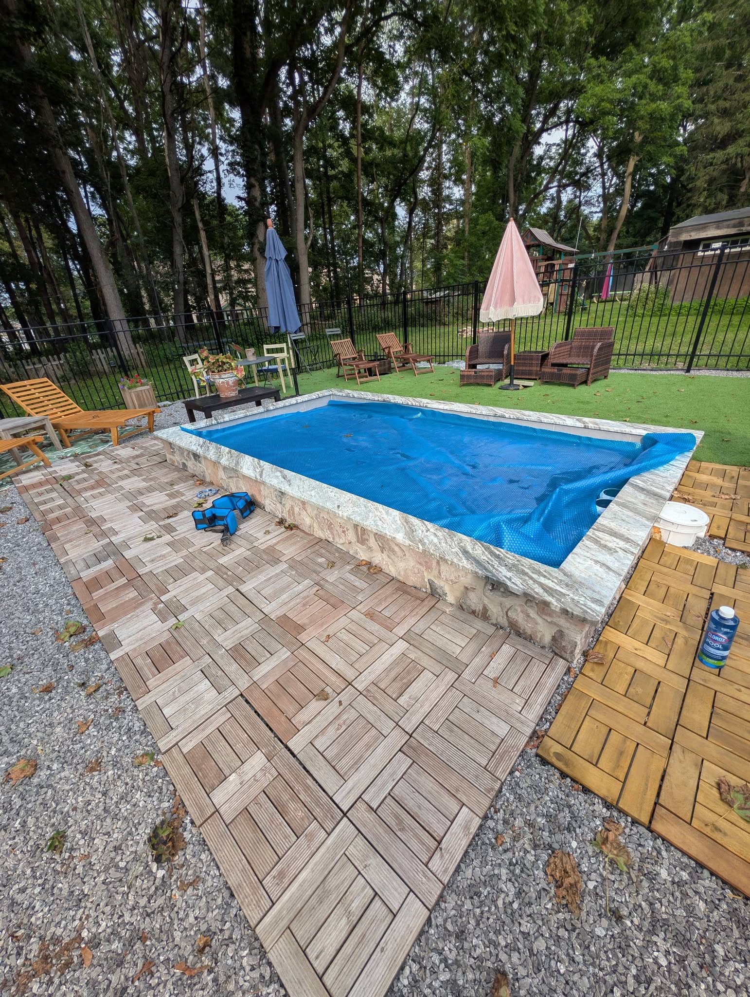 In-ground spa with flagstone veneer and granite coping